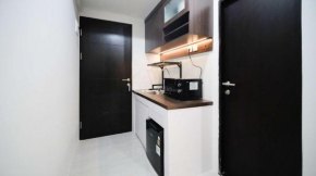 Modern and Simple Studio (No Kitchen) Apartment at Suncity Residence By Travelio